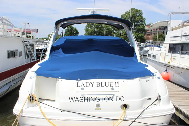  Yacht Photos Pics 2003 Sea Ray 380 Sundancer docked, covered in blue tarp, labeled "Lady Blue II," Washington DC.