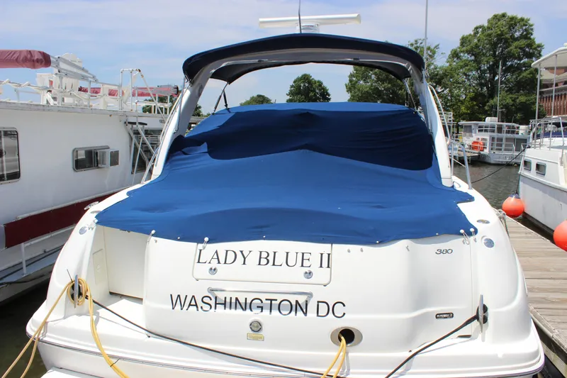  Yacht Photos Pics 2003 Sea Ray 380 Sundancer yacht docked, covered in blue tarp, named "Lady Blue II".