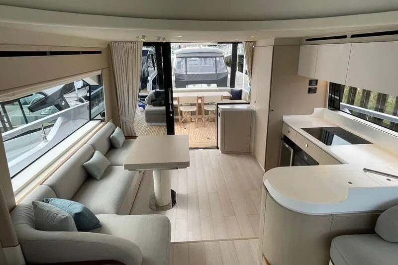  Yacht Photos Pics Luxurious interior of 2022 Azimut Fly 68 yacht with modern kitchen and seating area.