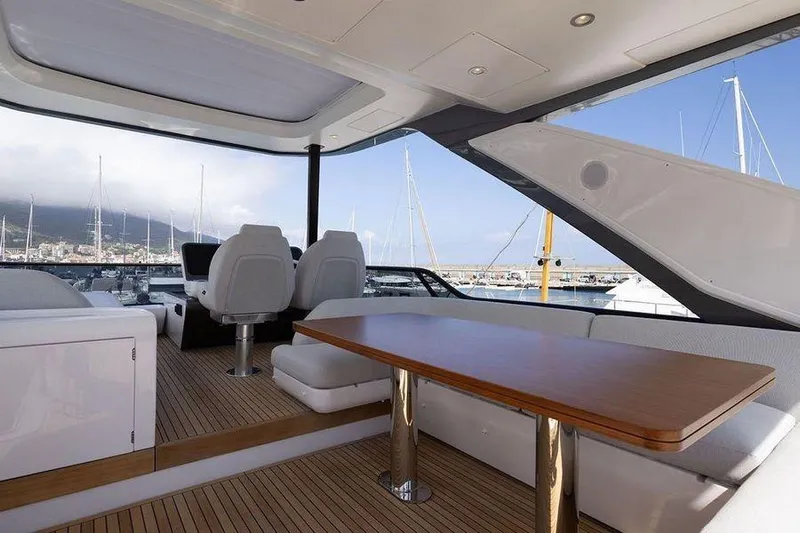  Yacht Photos Pics Luxurious interior of 2022 Azimut Fly 68 yacht with elegant seating and wooden table.