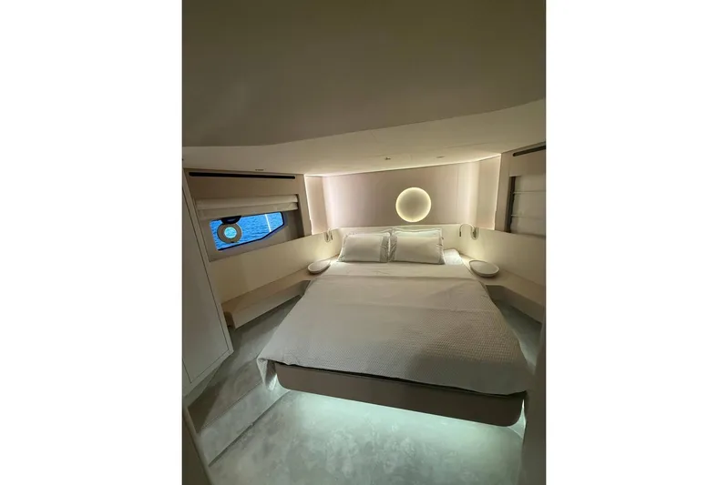  Yacht Photos Pics Luxurious bedroom interior of 2022 Azimut Fly 68 yacht with modern design and ambient lighting.