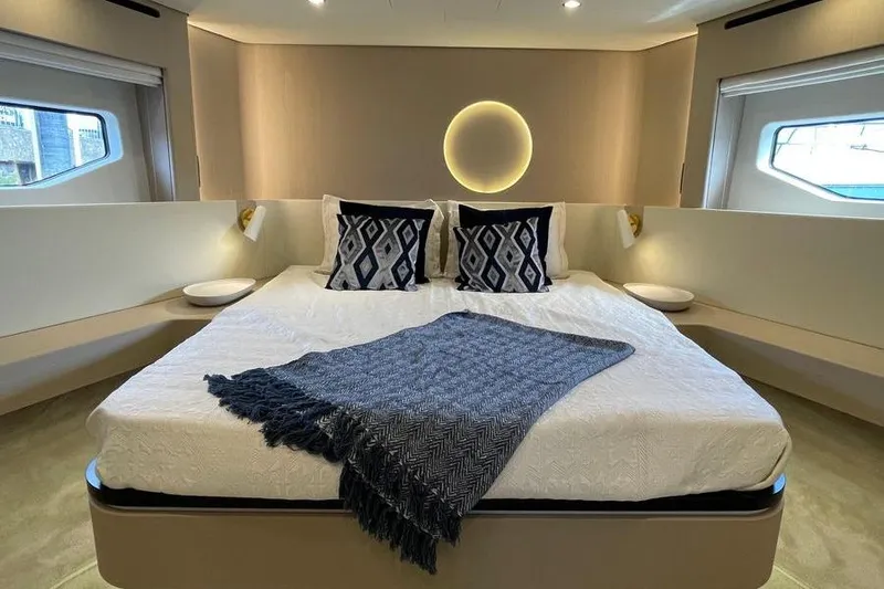  Yacht Photos Pics Luxurious bedroom interior of 2022 Azimut Fly 68 yacht with modern decor and elegant bedding.