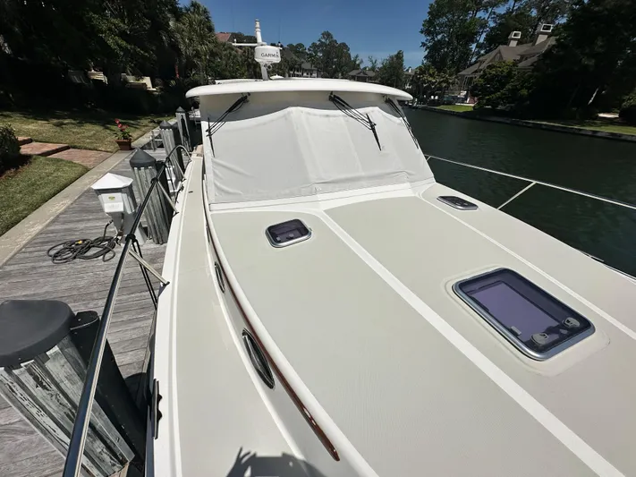  Yacht Photos Pics 2022 Back Cove 372 boat docked, featuring sleek design and modern equipment.