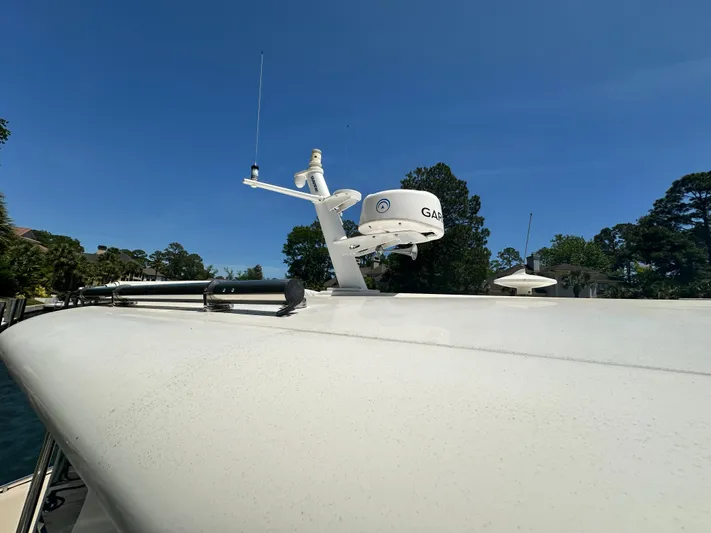  Yacht Photos Pics 2022 Back Cove 372 boat with radar equipment against clear blue sky.
