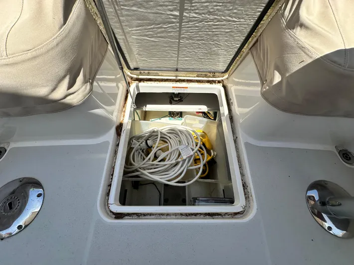  Yacht Photos Pics Open storage compartment on 2022 Back Cove 372 boat, containing coiled cables and equipment.