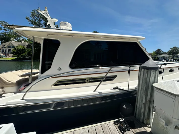  Yacht Photos Pics 2022 Back Cove 372 yacht docked at marina under clear blue sky.