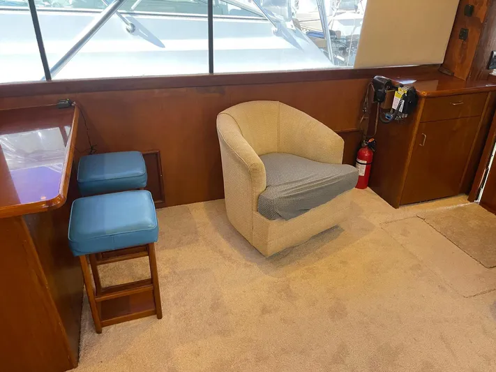 Occtane Yacht Photos Pics Interior of 1990 Ocean Yachts 44 Super Sport with seating and wooden cabinetry.