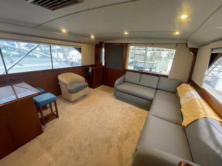 Occtane Yacht Photos Pics Luxurious interior of 1990 Ocean Yachts 44 Super Sport with comfortable seating and elegant design.