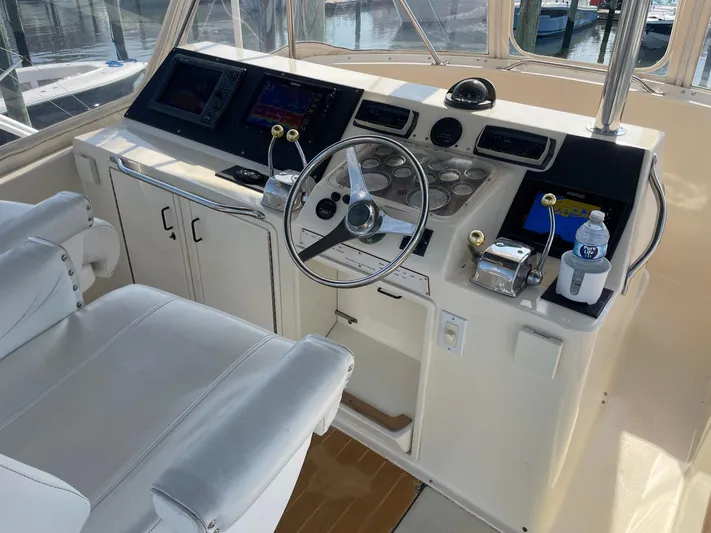 Occtane Yacht Photos Pics Cockpit of 1990 Ocean Yachts 44 Super Sport with steering wheel and navigation equipment.