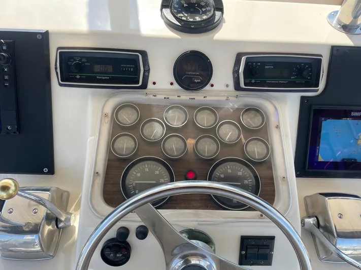 Occtane Yacht Photos Pics Control panel of a 1990 Ocean Yachts 44 Super Sport with gauges and navigation equipment.