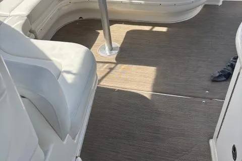  Yacht Photos Pics Interior view of 2003 Sea Ray 340 Sundancer boat with white seating and wooden flooring.