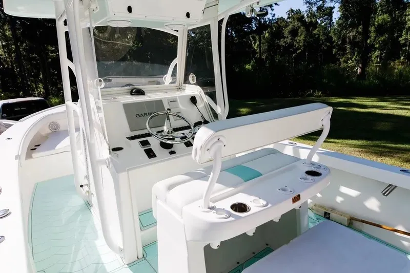  Yacht Photos Pics 2017 Albury Brothers center console boat with Garmin navigation, white seating, and cup holders.