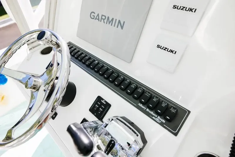  Yacht Photos Pics 2017 Albury Brothers center console boat dashboard with Garmin and Suzuki controls.
