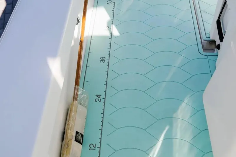  Yacht Photos Pics 2017 Albury Brothers center console boat deck with measuring scale and textured pattern.