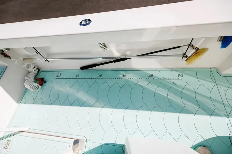  Yacht Photos Pics 2017 Albury Brothers center console boat deck with measuring ruler and cleaning tools.