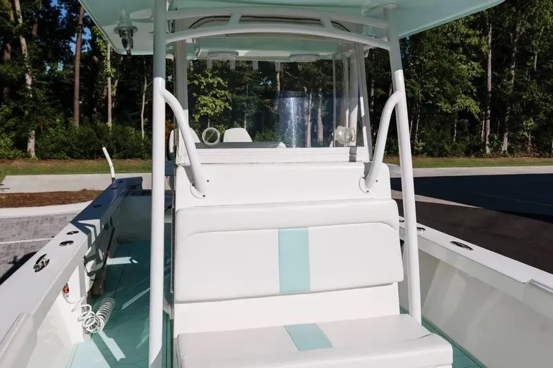  Yacht Photos Pics 2017 Albury Brothers center console boat with white seating and teal accents.