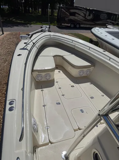  Yacht Photos Pics 2009 Pursuit 3400 Offshore boat interior with seating and storage compartments.