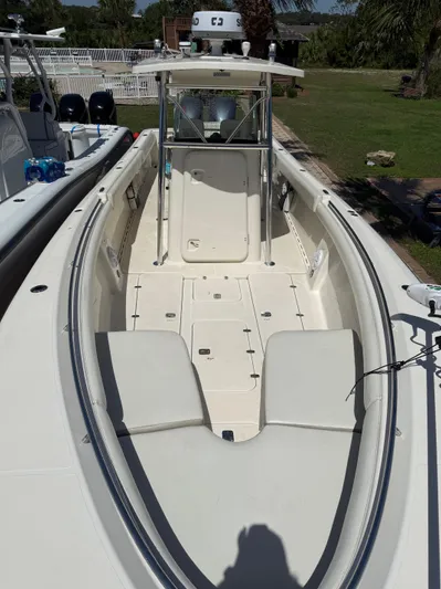  Yacht Photos Pics 2009 Pursuit 3400 Offshore boat, spacious deck, sleek design, outdoor setting.