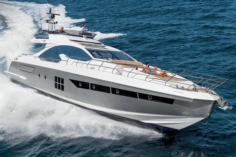  Yacht Photos Pics Luxury 2015 Azimut 77S yacht cruising on open sea with passengers relaxing.