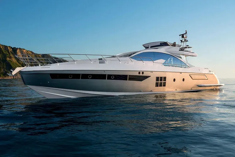  Yacht Photos Pics Luxury 2015 Azimut 77S yacht cruising on serene ocean waters at sunset.