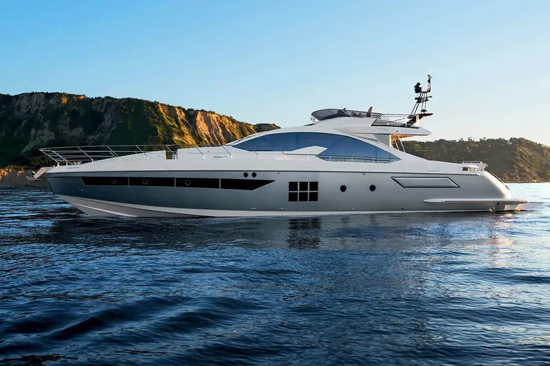  Yacht Photos Pics Luxury 2015 Azimut 77S yacht cruising near scenic coastal cliffs.