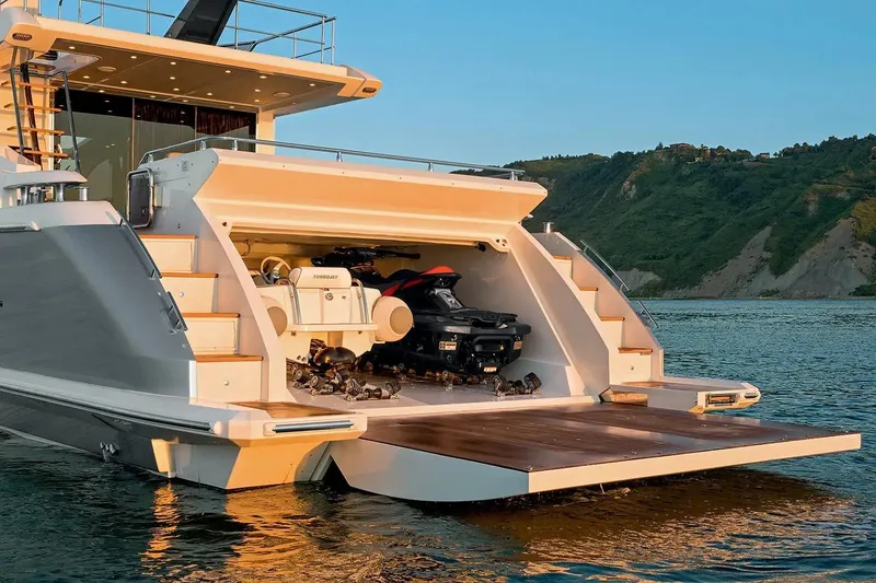  Yacht Photos Pics Luxury Azimut 77S yacht with open garage and jet ski, 2015 model, on serene water.