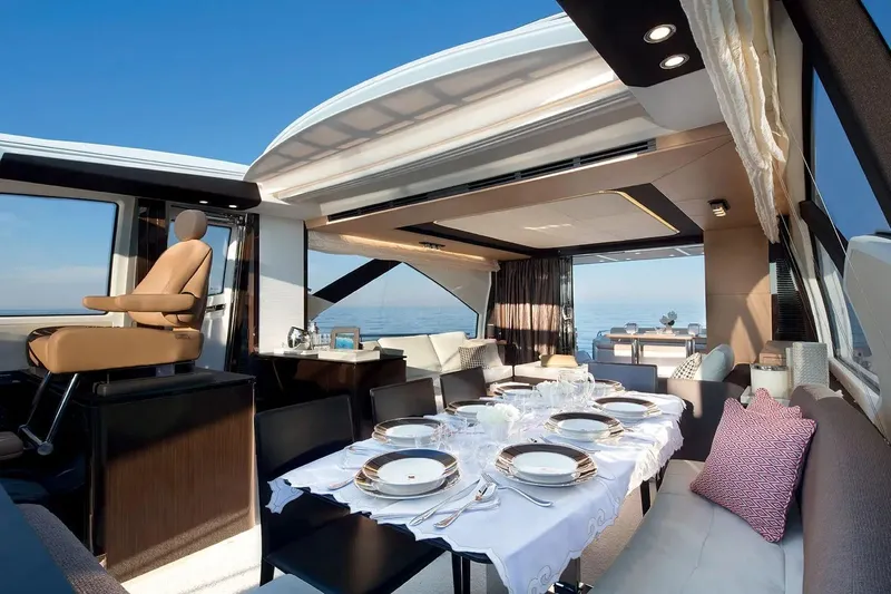  Yacht Photos Pics Luxurious interior of 2015 Azimut 77S yacht with elegant dining setup and ocean view.