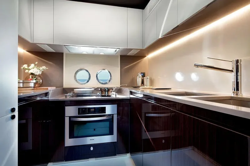  Yacht Photos Pics Luxurious kitchen interior of 2015 Azimut 77S yacht with modern appliances and sleek design.