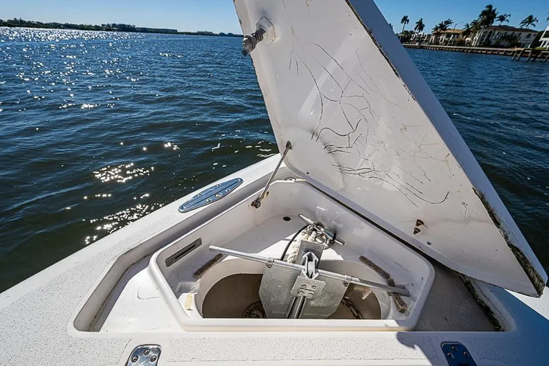  Yacht Photos Pics Open anchor compartment on 2005 Intrepid 300 Center Console boat, with scenic water view.