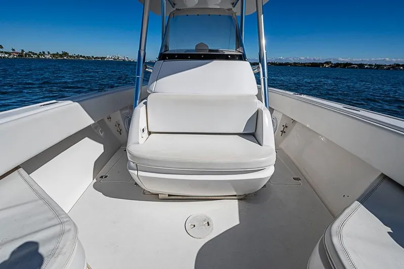  Yacht Photos Pics 2005 Intrepid 300 Center Console boat interior with white seating on open water.