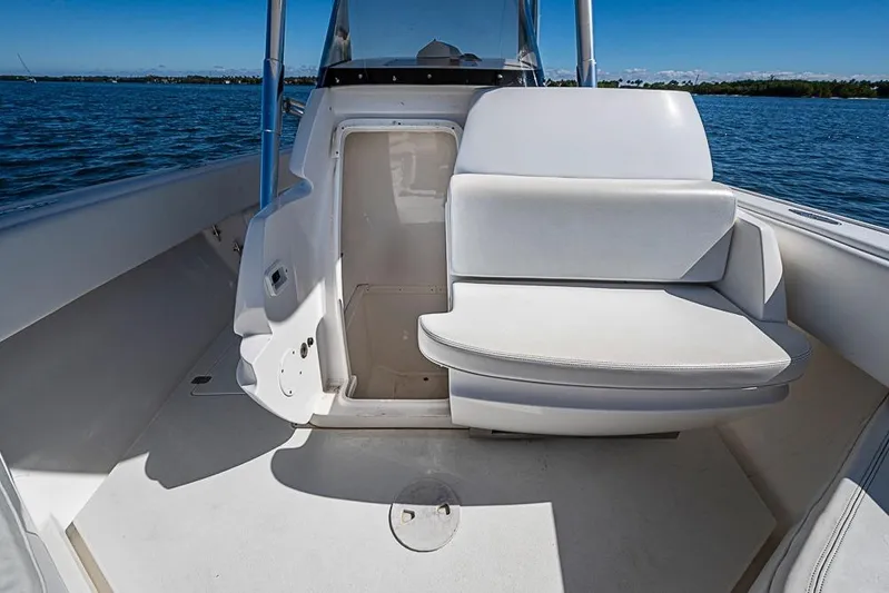  Yacht Photos Pics 2005 Intrepid 300 Center Console boat interior with seating and open storage compartment.