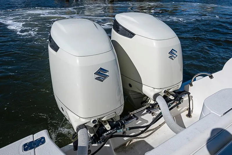  Yacht Photos Pics Twin Suzuki outboard engines on a 2005 Intrepid 300 Center Console boat.