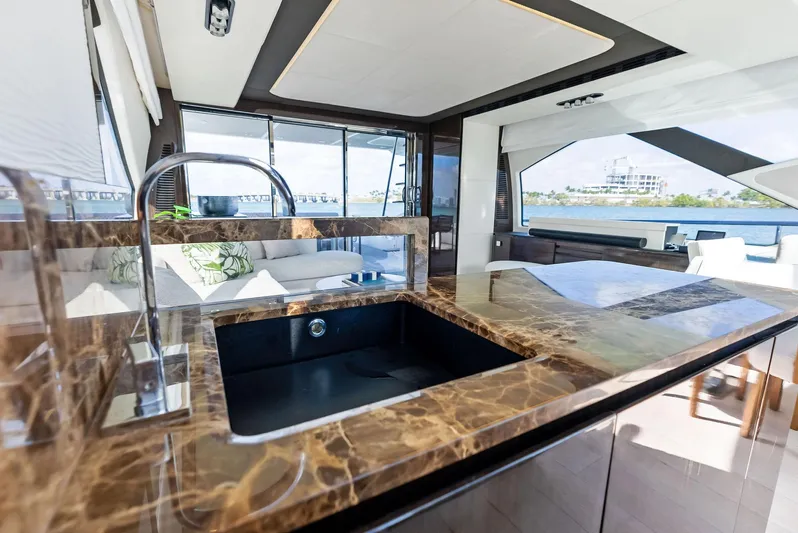 Panda Yacht Photos Pics Luxurious kitchen interior of 2017 Azimut 77S yacht with marble countertops and modern design.