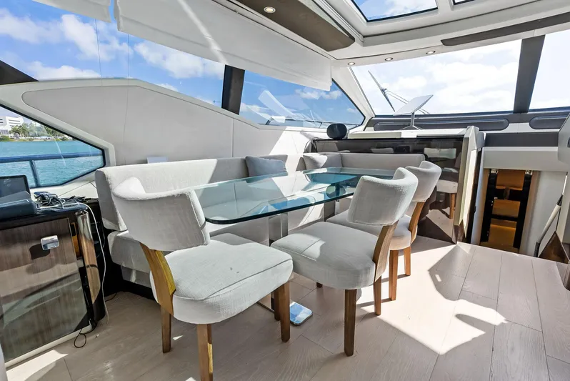 Panda Yacht Photos Pics Luxurious interior of 2017 Azimut 77S yacht with elegant dining area and panoramic windows.