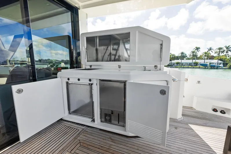 Panda Yacht Photos Pics Outdoor kitchen on 2017 Azimut 77S yacht with open cabinets and ocean view.