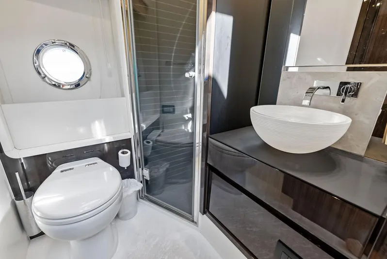Panda Yacht Photos Pics Luxury bathroom in 2017 Azimut 77S yacht with modern fixtures and sleek design.