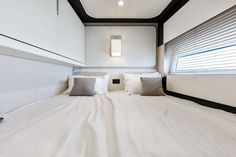 Panda Yacht Photos Pics Luxurious bedroom interior of 2017 Azimut 77S yacht with modern design and cozy bedding.