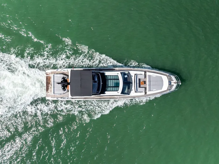 Panda Yacht Photos Pics Aerial view of 2017 Azimut 77S yacht cruising on green water.