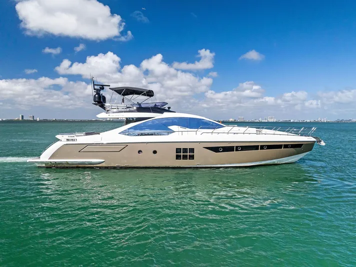 Panda Yacht Photos Pics 2017 Azimut 77S yacht cruising on open water under a clear blue sky.