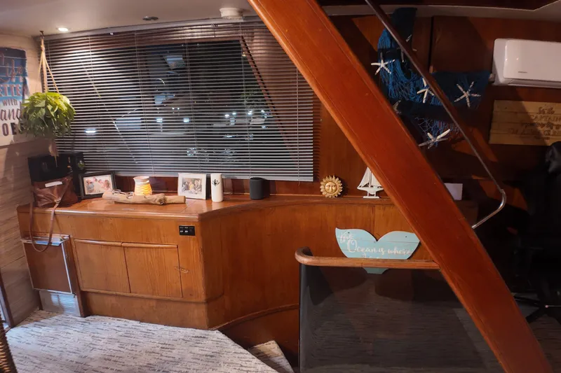  Yacht Photos Pics Interior of 1987 Viking Gulfstar yacht with wooden decor and nautical-themed decorations.