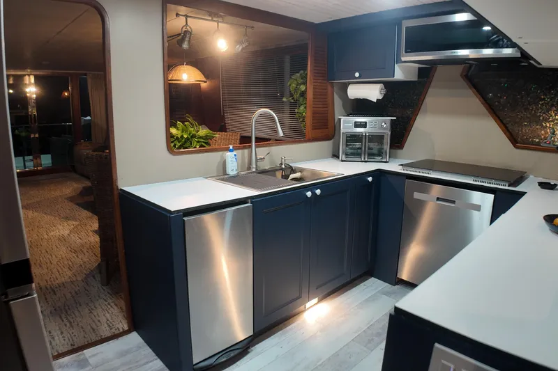  Yacht Photos Pics Modern kitchen interior on 1987 Viking Gulfstar yacht with sleek appliances and stylish design.