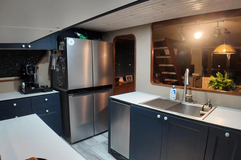  Yacht Photos Pics Modern kitchen interior on a 1987 Viking Gulfstar boat with stainless steel appliances.