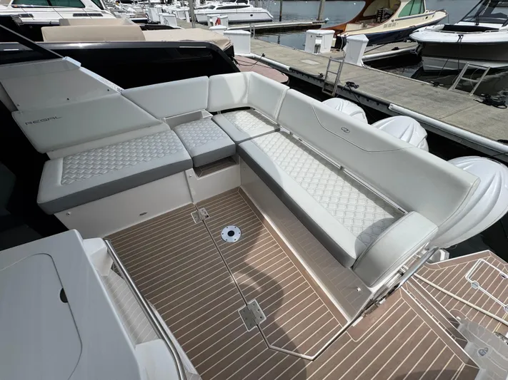 19th Hole Yacht Photos Pics 2024 Regal 38 XO yacht with spacious, luxurious seating and elegant deck design.