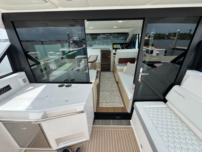 19th Hole Yacht Photos Pics 2024 Regal 38 XO yacht interior with modern seating and sleek design.