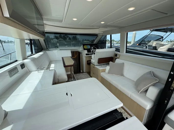 19th Hole Yacht Photos Pics Luxurious interior of 2024 Regal 38 XO yacht with white seating and modern design.