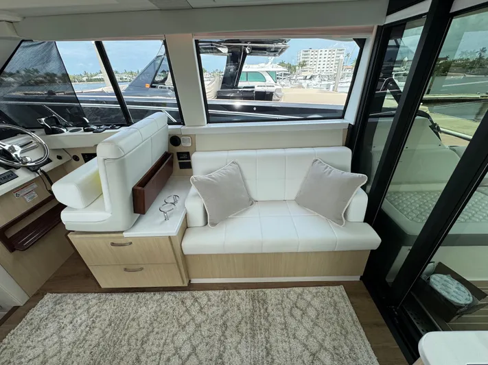 19th Hole Yacht Photos Pics 2024 Regal 38 XO yacht interior with white seating and modern design.