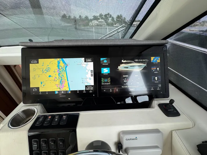 19th Hole Yacht Photos Pics 2024 Regal 38 XO yacht dashboard with dual navigation screens and Garmin system.
