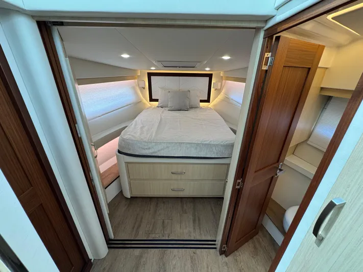 19th Hole Yacht Photos Pics 2024 Regal 38 XO yacht interior with cozy bedroom and modern design.