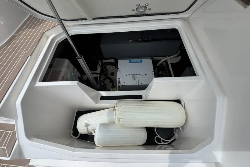 19th Hole Yacht Photos Pics 2024 Regal 38 XO boat storage compartment with fenders and equipment.