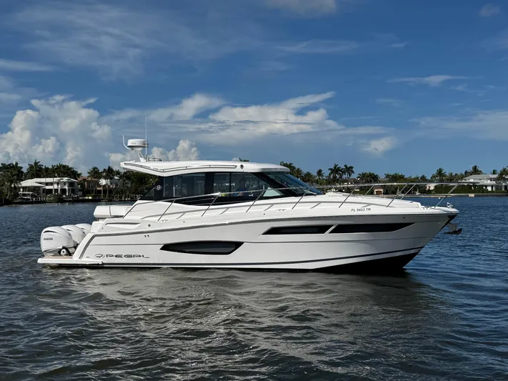 19th Hole Yacht Photos Pics 2024 Regal 38 XO yacht cruising on a sunny day with a clear blue sky.